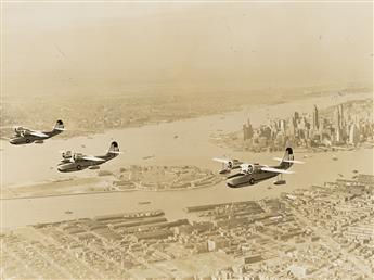(TAKE FLIGHT OVER MANHATTAN) A collection of approximately 44 photographs of airplanes in flight over New York City. Circa 1930-42.